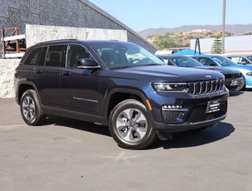 2024 Jeep Grand Cherokee 4xe in a Midnight Sky exterior color. Glendora Chrysler Dodge Jeep Ram 909-506-2515 glendorachryslerjeepdodge.com 