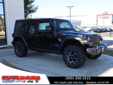 2022 Jeep Wrangler Rubicon 4xe in a Black Clear Coat exterior color and Blackinterior. Glendora Chrysler Dodge Jeep Ram 909-506-2515 glendorachryslerjeepdodge.com 