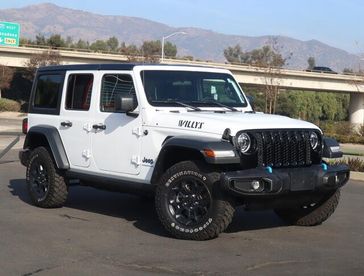 2023 Jeep Wrangler 4xE  in a BRIGHT WHITE exterior color. Glendora Chrysler Dodge Jeep Ram 909-506-2515 glendorachryslerjeepdodge.com 