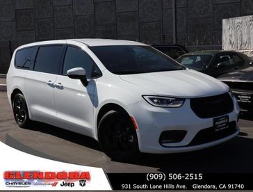 2023 Chrysler Pacifica Plug-in Hybrid Touring L in a Bright White Clear Coat exterior color. Glendora Chrysler Dodge Jeep Ram 909-506-2515 glendorachryslerjeepdodge.com 
