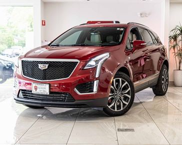 2023 Cadillac XT5 Sport in a Radiant Red Tint Coat exterior color and Cirrusinterior. Aston Martin of Glenview 847-904-1233 astonmartinofglenview.com 
