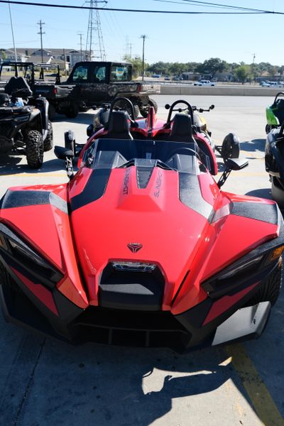 NEW 2025 POLARIS SLINGSHOT S AUTODRIVE  in a SLINGSHOT RED exterior color. Family PowerSports (877) 886-1997 familypowersports.com 