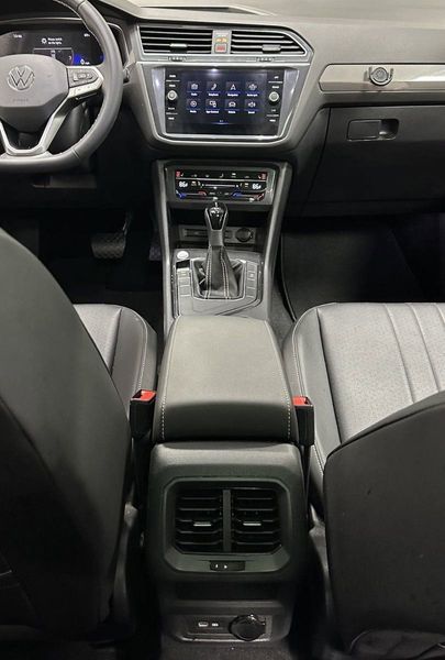 2023 Volkswagen Tiguan SE w/Sunroof & 3rd Row in a Kings Red Metallic exterior color and Black Heated Seatsinterior. Schmelz Countryside Alfa Romeo (651) 867-3222 schmelzalfaromeo.com 