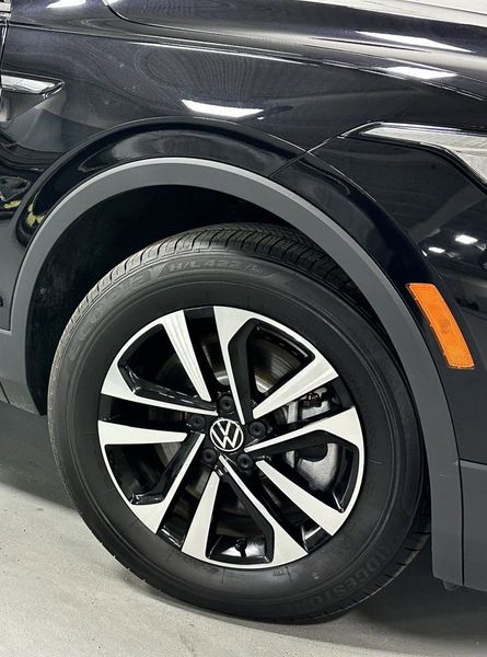 2023 Volkswagen Tiguan S / Driver Asst Pkg in a Deep Black Pearl exterior color and Black Heated Seatsinterior. Schmelz Countryside Alfa Romeo (651) 867-3222 schmelzalfaromeo.com 