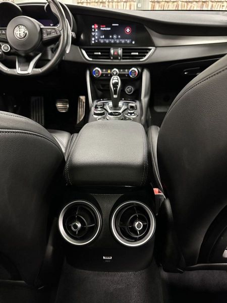 2021 Alfa Romeo Giulia Ti Sport Nero AWD w/Sunroof & Nav in a Vesuvio Gray Metallic exterior color and Black Heated Sport Leatherinterior. Schmelz Countryside Alfa Romeo (651) 867-3222 schmelzalfaromeo.com 