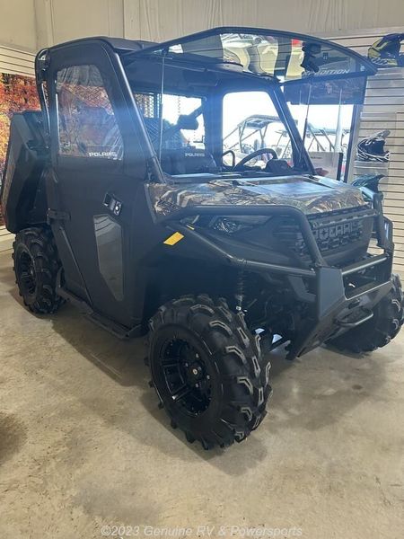 2024 Polaris Ranger 1000 Premium in a Polaris Pursuit Camo exterior color. Genuine RV & Powersports (936) 569-2523 