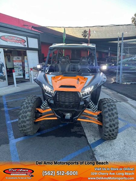 2023 Kawasaki KRT1000APFNL  in a METALLIC FLAT RAW GRAYSTONE/CANDY STEEL FURNACE ORANGE exterior color. Del Amo Motorsports of Long Beach (562) 362-3160 delamomotorsports.com 