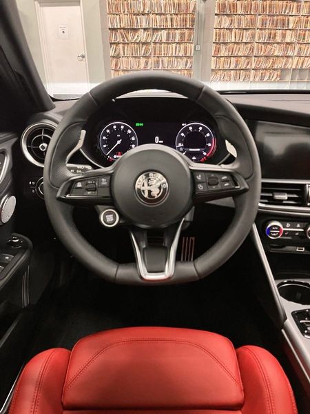 2024 Alfa Romeo Giulia Veloce Awd in a Vulcano Black Metallic exterior color and Red Sport Heated Leatherinterior. Schmelz Countryside Alfa Romeo (651) 867-3222 schmelzalfaromeo.com 