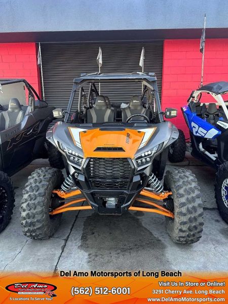 2023 Kawasaki KRT1000APFNL  in a METALLIC FLAT RAW GRAYSTONE/CANDY STEEL FURNACE ORANGE exterior color. Del Amo Motorsports of Long Beach (562) 362-3160 delamomotorsports.com 