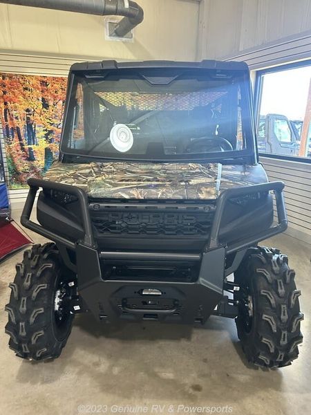 2024 Polaris Ranger 1000 Premium in a Polaris Pursuit Camo exterior color. Genuine RV & Powersports (936) 569-2523 