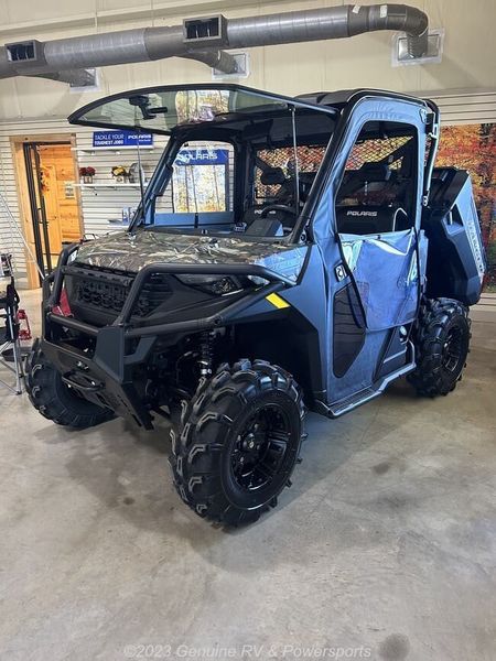 2024 Polaris Ranger 1000 Premium in a Polaris Pursuit Camo exterior color. Genuine RV & Powersports (936) 569-2523 