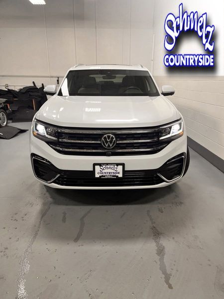 2023 Volkswagen Atlas Cross Sport SEL Premium R-Line AWD w/Sunroof & Navi in a Opal White Pearl exterior color and Cinnamon Brown Heated & Vented Leatherinterior. Schmelz Countryside SAAB (888) 558-1064 stpaulsaab.com 