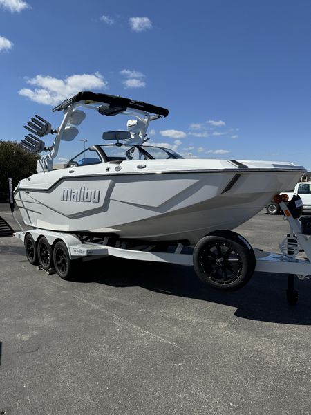 2025 MALIBU MSERIES M230  in a WHITE AND BLUE exterior color. Family PowerSports (877) 886-1997 familypowersports.com 