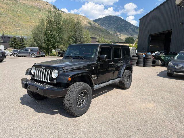 Used 2016 Jeep Wrangler Unlimited Sahara with VIN 1C4BJWEG9GL334678 for sale in Jackson, WY