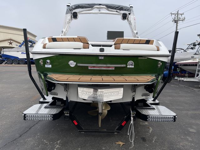 2023 MALIBU Wakesetter 23 MXZ  in a WHITE/GREEN exterior color. Family PowerSports (877) 886-1997 familypowersports.com 