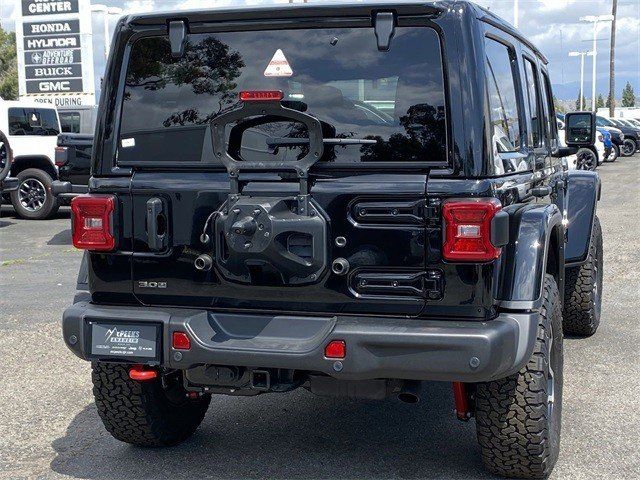 2023 Jeep Wrangler 4-door Rubicon 4x4 in a Black Clear Coat exterior color and Blackinterior. McPeek