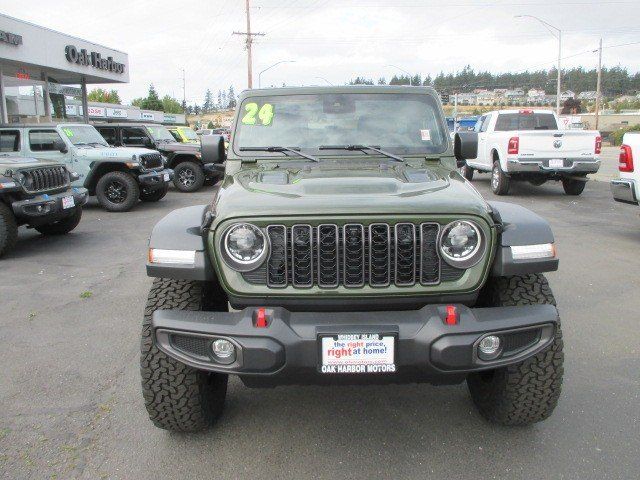 2024 Jeep Wrangler 4-door Rubicon in a Sarge Green Clear Coat exterior color and Blackinterior. Oak Harbor Motors Inc. 360-323-6434 ohmotors.com 