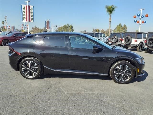 2023 Kia EV6 Wind in a Aurora Black Pearl exterior color and Charcoal/Misty Grayinterior. Perris Valley Chrysler Dodge Jeep Ram 951-355-1970 perrisvalleydodgejeepchrysler.com 