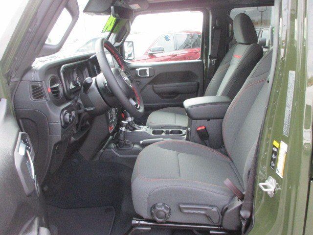 2024 Jeep Wrangler 4-door Rubicon in a Sarge Green Clear Coat exterior color and Blackinterior. Oak Harbor Motors Inc. 360-323-6434 ohmotors.com 