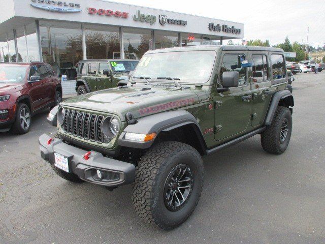 2024 Jeep Wrangler 4-door Rubicon in a Sarge Green Clear Coat exterior color and Blackinterior. Oak Harbor Motors Inc. 360-323-6434 ohmotors.com 