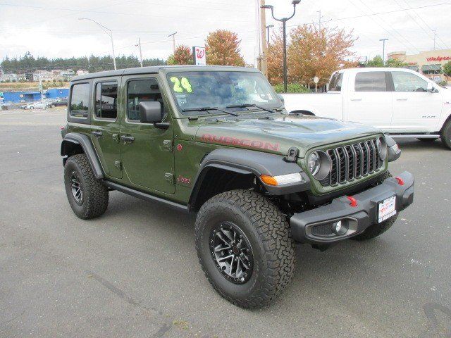 2024 Jeep Wrangler 4-door Rubicon in a Sarge Green Clear Coat exterior color and Blackinterior. Oak Harbor Motors Inc. 360-323-6434 ohmotors.com 