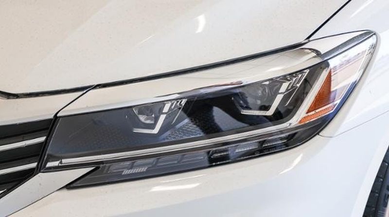 2022 Volkswagen Passat 2.0T SE Auto in a PURE WHITE exterior color and TITAN BLACK LEATHERETTEinterior. BEACH BLVD OF CARS beachblvdofcars.com 