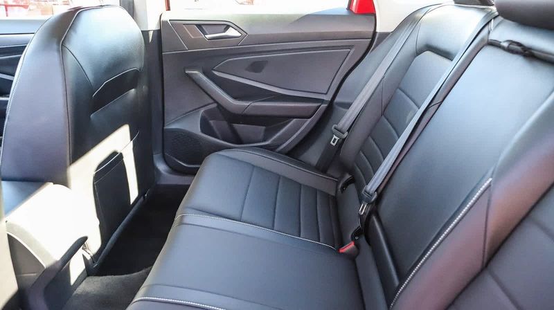 2023 Volkswagen Jetta SE in a Kings Red Metallic exterior color and Titan Blackinterior. BEACH BLVD OF CARS beachblvdofcars.com 