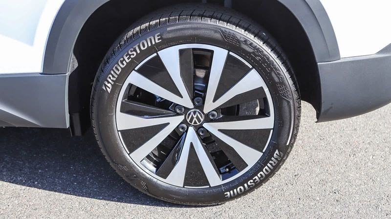 2024 Volkswagen Taos SE in a Pure White exterior color and Grayinterior. BEACH BLVD OF CARS beachblvdofcars.com 