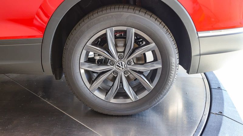 2023 Volkswagen Tiguan SE in a Kings Red Metallic exterior color and Titan Blackinterior. BEACH BLVD OF CARS beachblvdofcars.com 