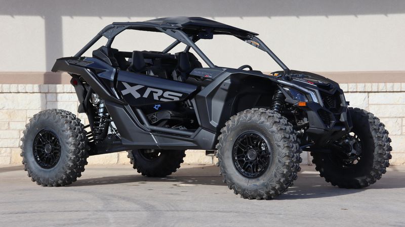 2025 CAN-AM MAVERICK X3 X RS TURBO RR WITH SMARTSHOX TRIPLE BLACK in a TRIPLE BLACK exterior color. Family PowerSports (877) 886-1997 familypowersports.com 