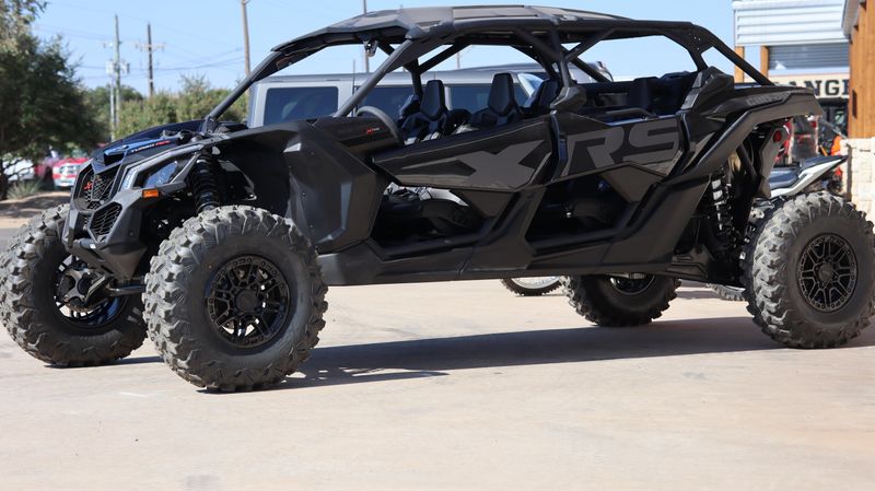 2025 CAN-AM MAVERICK X3 X RS TURBO RR WITH SMARTSHOX TRIPLE BLACK in a TRIPLE BLACK exterior color. Family PowerSports (877) 886-1997 familypowersports.com 