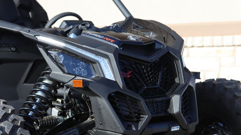 2025 CAN-AM MAVERICK X3 X RS TURBO RR WITH SMARTSHOX TRIPLE BLACK in a TRIPLE BLACK exterior color. Family PowerSports (877) 886-1997 familypowersports.com 