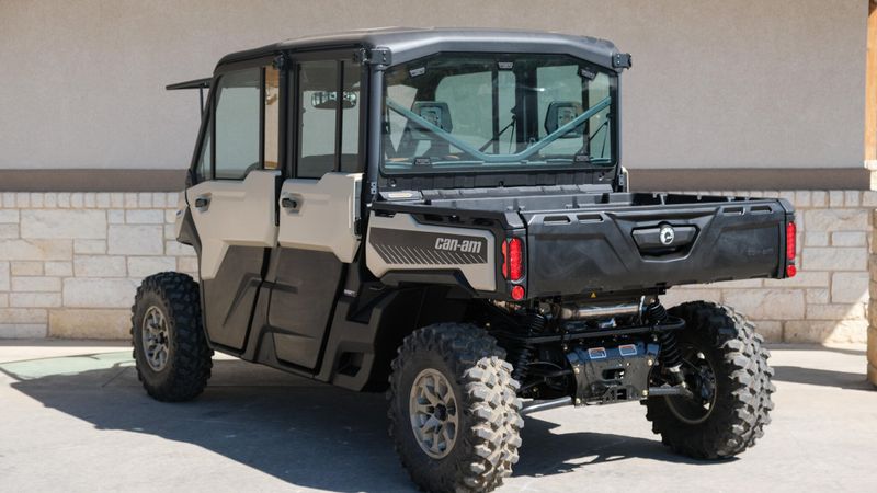 2025 CAN-AM DEFENDER MAX LIMITED CAB HD10 DESERT TAN AND STEALTH BLACK in a DESERT TAN AND STEALTH BLACK exterior color. Family PowerSports (877) 886-1997 familypowersports.com 