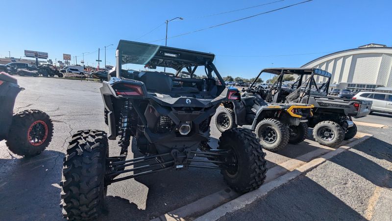 2025 CAN-AM MAVERICK X3 MAX X RS TURBO RR TRIPLE BLACK in a TRIPLE BLACK exterior color. Family PowerSports (877) 886-1997 familypowersports.com 