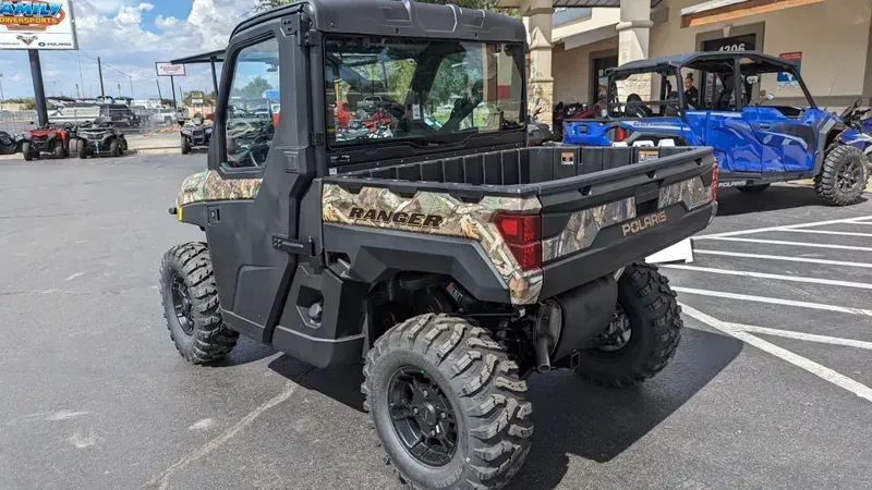 2024 POLARIS RANGER XP 1000 NS ED ULT  RIDE CMD PPC in a CAMO exterior color. Family PowerSports (877) 886-1997 familypowersports.com 