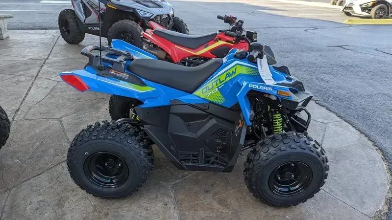 2024 Polaris OUTLAW 70 EFI VELOCITY BLUE AND LIFTED LIMEImage 2