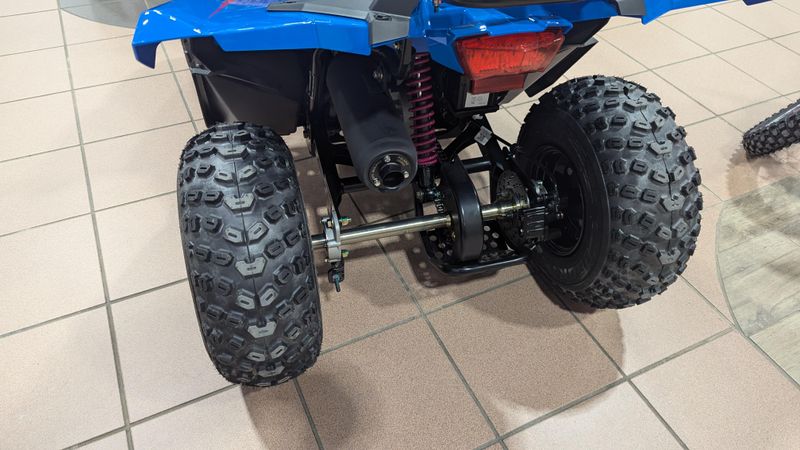 2025 POLARIS OUTLAW 70 EFI  VELOCITY BLUE AND FIERCE FUCHSIA in a VELOCITY BLUE AND FIERCE FUCHSIA exterior color. Family PowerSports (877) 886-1997 familypowersports.com 