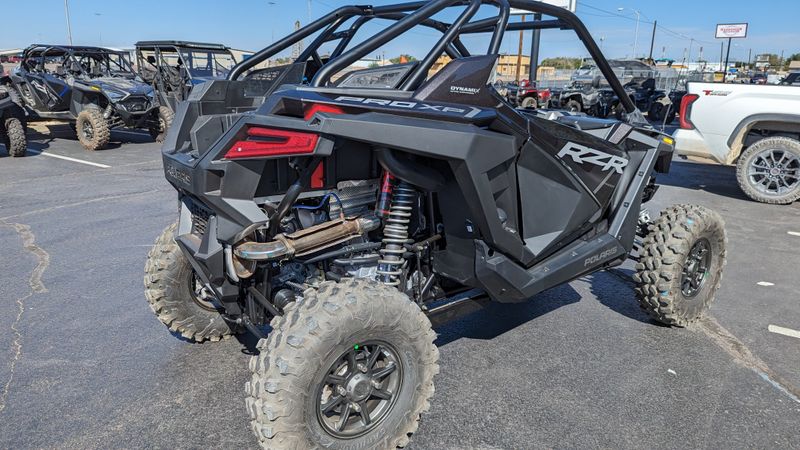 2024 POLARIS RZR PRO XP ULTIMATE  SUPER GRAPHITE in a GRAPHITE exterior color. Family PowerSports (877) 886-1997 familypowersports.com 