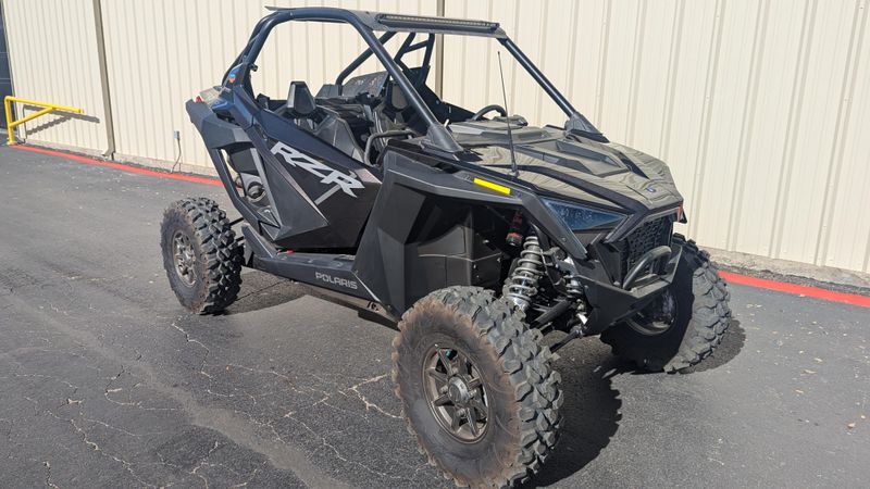 2024 POLARIS RZR PRO XP ULTIMATE  SUPER GRAPHITE in a GRAPHITE exterior color. Family PowerSports (877) 886-1997 familypowersports.com 