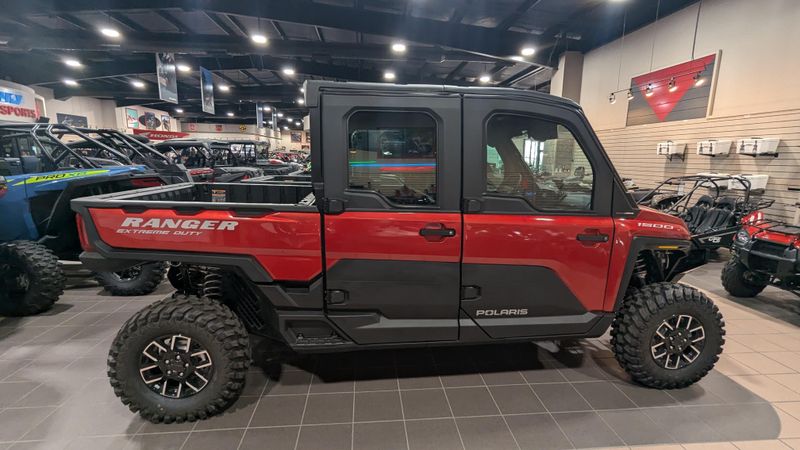 2024 POLARIS RANGER CREW XD 1500 NORTHSTAR EDITION ULTIMATE SUNSET RED in a SUNSET RED exterior color. Family PowerSports (877) 886-1997 familypowersports.com 