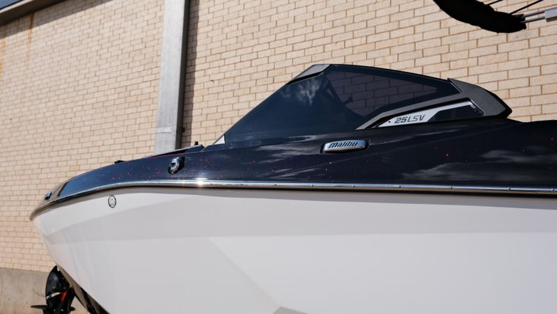 2025 MALIBU WAKESETTER 25 LSV  in a RED-BLACK-WHITE exterior color. Family PowerSports (877) 886-1997 familypowersports.com 