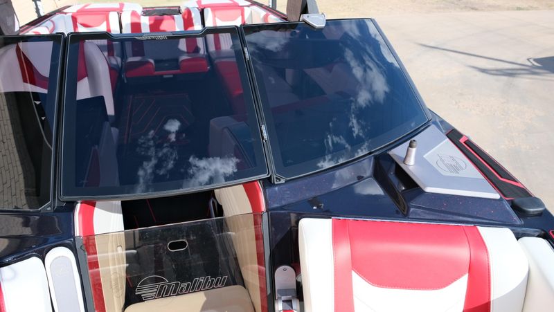 2025 MALIBU WAKESETTER 25 LSV  in a RED-BLACK-WHITE exterior color. Family PowerSports (877) 886-1997 familypowersports.com 