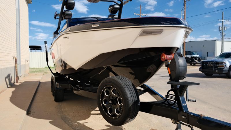 2025 MALIBU WAKESETTER 25 LSV  in a RED-BLACK-WHITE exterior color. Family PowerSports (877) 886-1997 familypowersports.com 