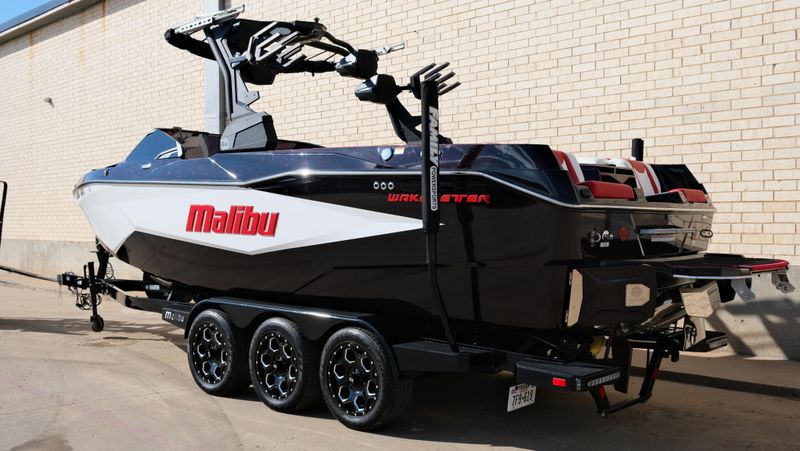 2025 MALIBU WAKESETTER 25 LSV  in a RED-BLACK-WHITE exterior color. Family PowerSports (877) 886-1997 familypowersports.com 