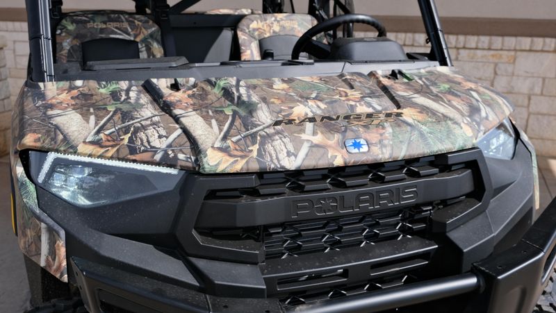 2025 POLARIS RANGER CREW 1000 PREMIUM PURSUIT CAMO in a POLARIS PURSUIT CAMO exterior color. Family PowerSports (877) 886-1997 familypowersports.com 