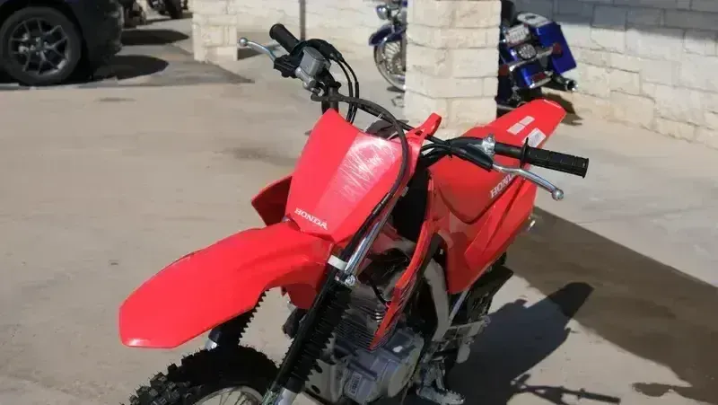 NEW 2026 HONDA CRF125F BIG WHEEL  in a RED exterior color. Family PowerSports (877) 886-1997 familypowersports.com