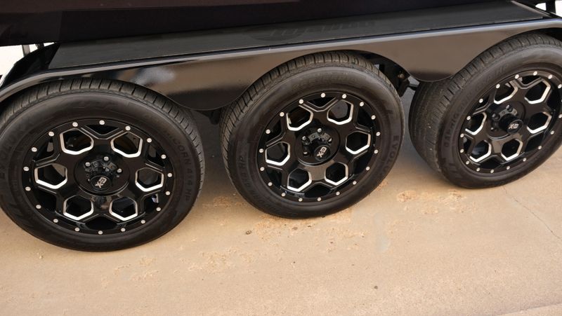 2025 MALIBU WAKESETTER 25 LSV  in a RED-BLACK-WHITE exterior color. Family PowerSports (877) 886-1997 familypowersports.com 