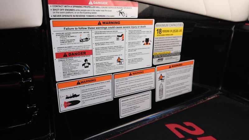 2025 MALIBU WAKESETTER 25 LSV  in a RED-BLACK-WHITE exterior color. Family PowerSports (877) 886-1997 familypowersports.com 