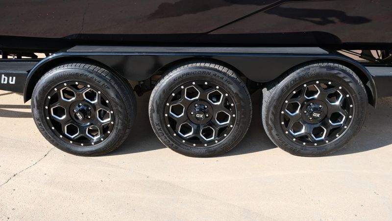 2025 MALIBU WAKESETTER 25 LSV  in a RED-BLACK-WHITE exterior color. Family PowerSports (877) 886-1997 familypowersports.com 