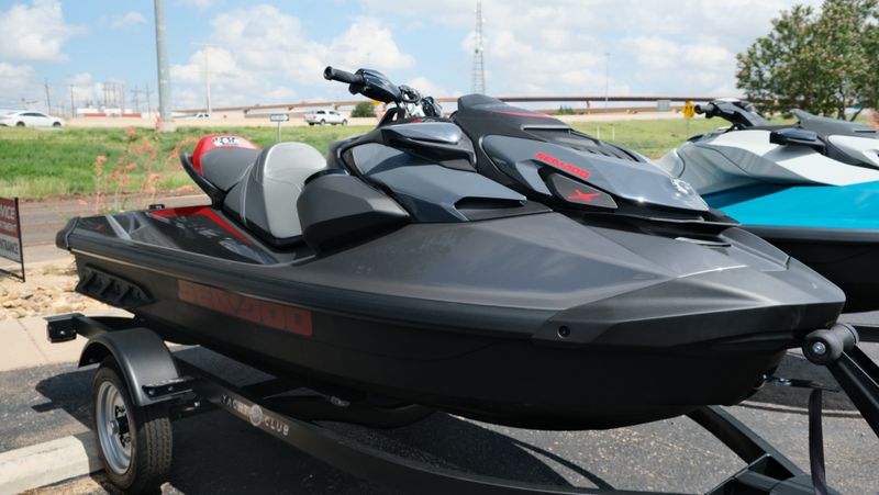 2024 SEADOO GTRX 300 WITH SOUND SYSTEM ECLIPSE BLACK AND DEEP MARSALA Image 1